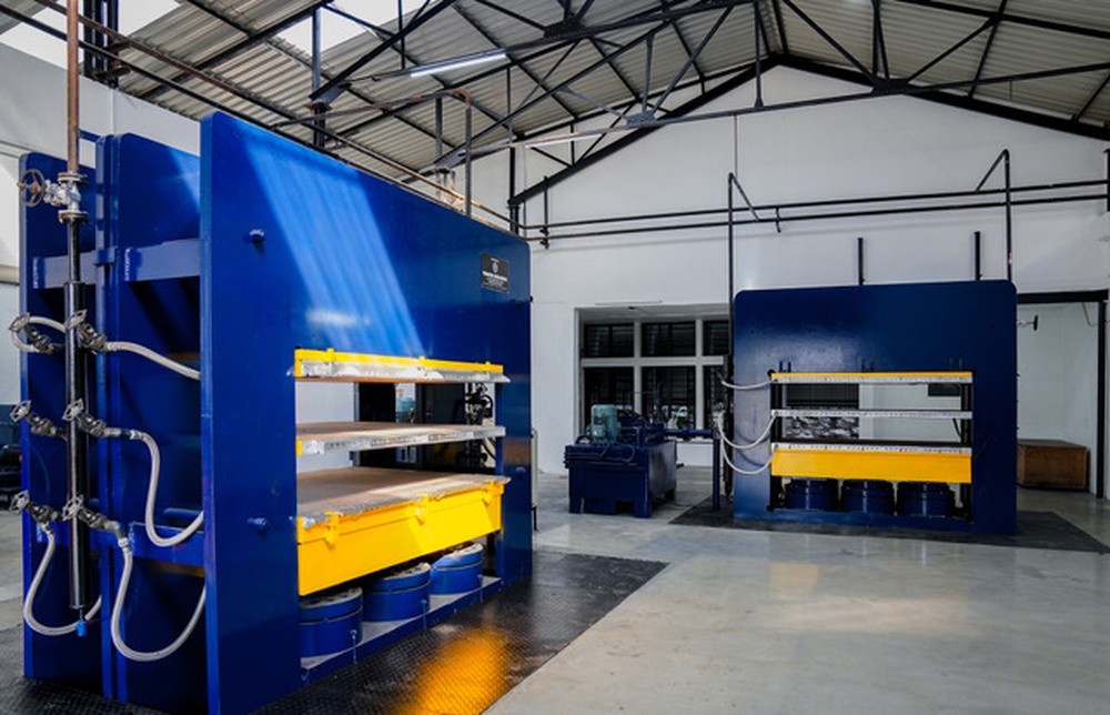 Two industrial press machines on the Highrange factory floor